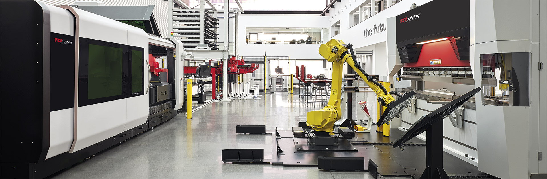 TCI Cutting showroom with fiber laser, yellow robot arm and press brake line