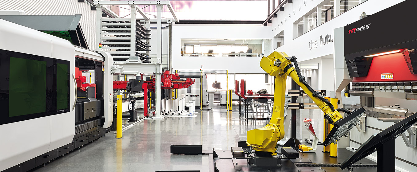 TCI Cutting showroom with fiber laser, yellow robot, press brake and sheet storage tower