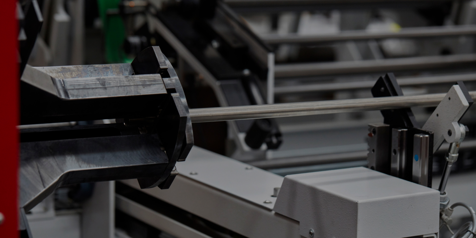 Close-up of TCI Cutting tube laser chuck clamping a metal tube for processing